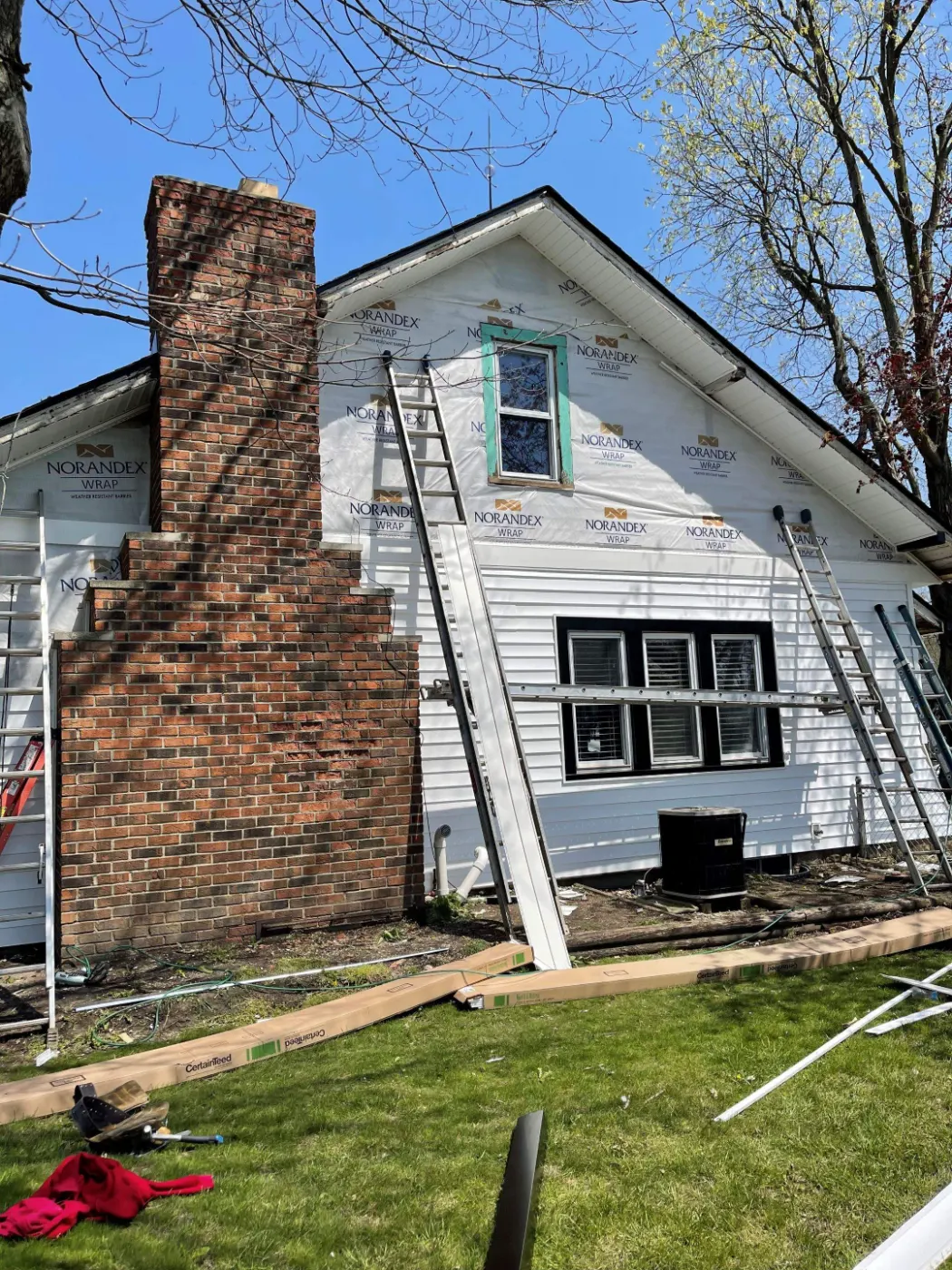 Siding installation documented in Raintree Village